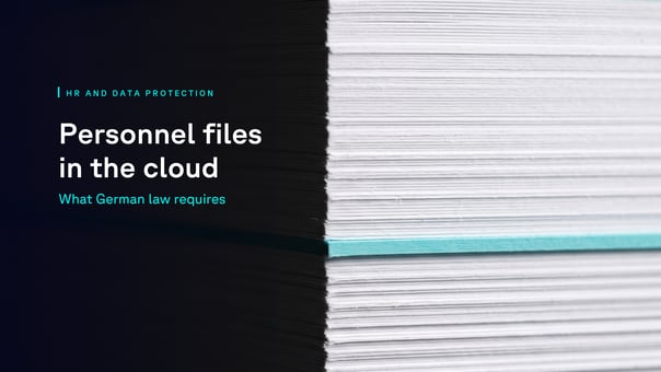  Side view of a tall stack of paper with a single teal divider sheet running through it